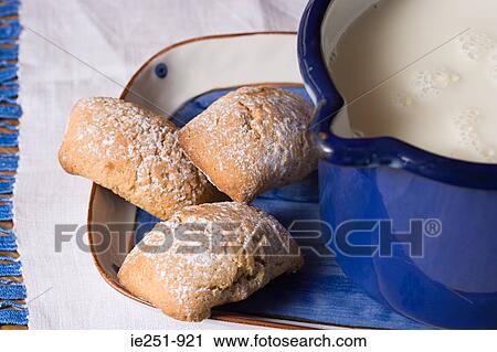 Biscuits and jug of milk View Large Photo Image Stock Image - Biscuits and jug of milk. Fotosearch