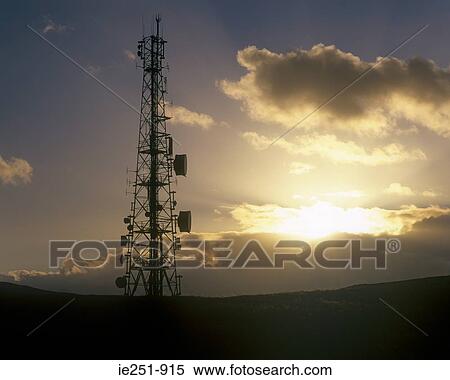 Stock Photography - Communication tower at sunrise. Fotosearch