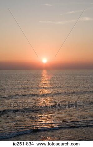 Picture - Sunset over the sea. Fotosearch