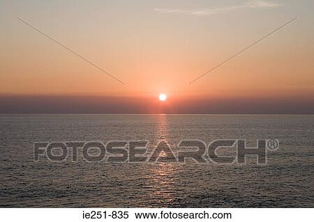 Sunset over the sea View Large Photo Image Stock Photography - Sunset over the sea. Fotosearch