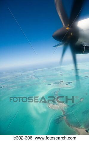 Airplane over florida View Large Photo Image Stock Photograph - Airplane over florida. Fotosearch