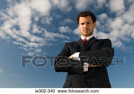 Businessman with arms crossed View Large Photo Image Stock Image - Businessman with arms crossed. Fotosearch