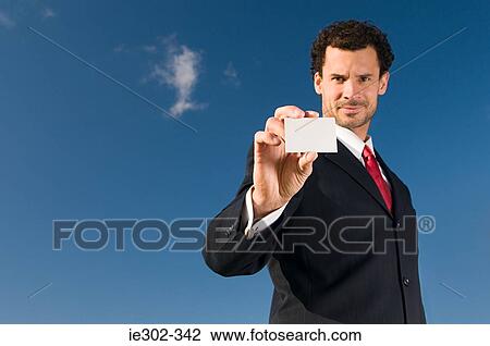 Businessman with business card View Large Photo Image Stock Image - Businessman with business card. Fotosearch