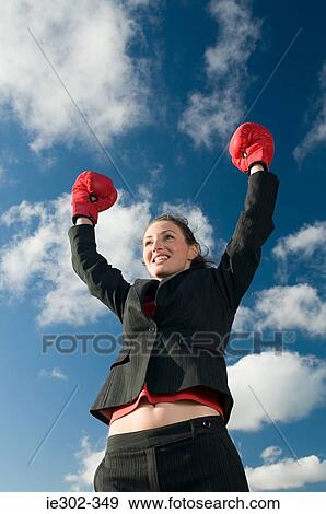 Businesswoman wearing boxing gloves View Large Photo Image Stock Photo - Businesswoman wearing boxing gloves. Fotosearch