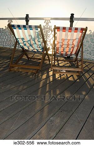 Deckchairs by the sea View Large Photo Image Stock Photograph - Deckchairs by the sea. Fotosearch