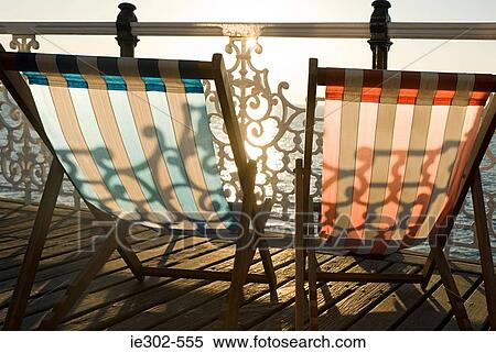 Deckchairs by the sea View Large Photo Image Stock Photography - Deckchairs by the sea. Fotosearch