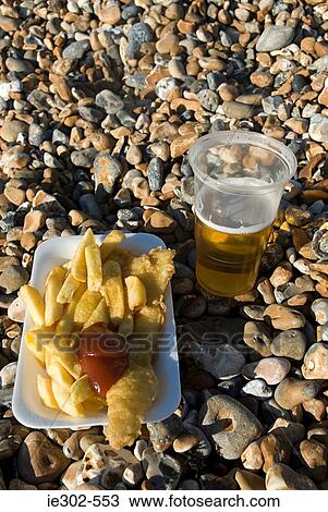 Fish and chips and lager View Large Photo Image Stock Image - Fish and chips and lager. Fotosearch