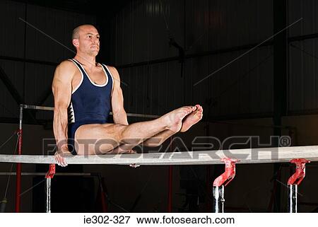 Gymnast on parallel bars View Large Photo Image Stock Photo - Gymnast on parallel bars. Fotosearch