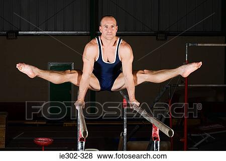 Gymnast on parallel bars View Large Photo Image Stock Photo - Gymnast on parallel bars. Fotosearch