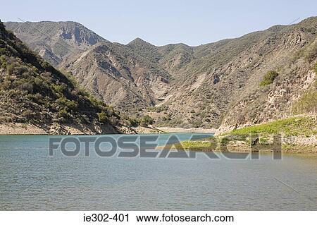 Lake surrounded by hills View Large Photo Image Stock Image - Lake surrounded by hills. Fotosearch