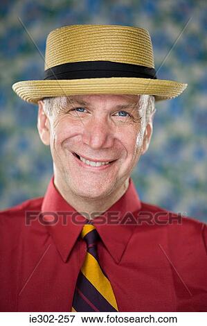 Man wearing straw hat View Large Photo Image Stock Photo - Man wearing straw hat. Fotosearch