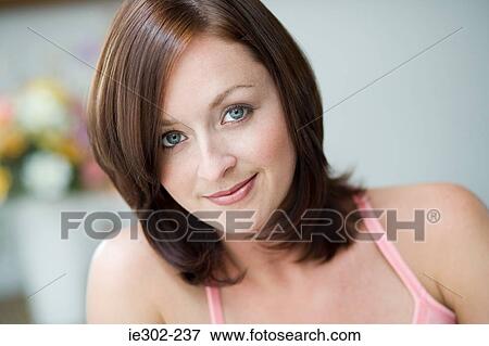 Portrait of a young woman View Large Photo Image Stock Photo - Portrait of a young woman. Fotosearch