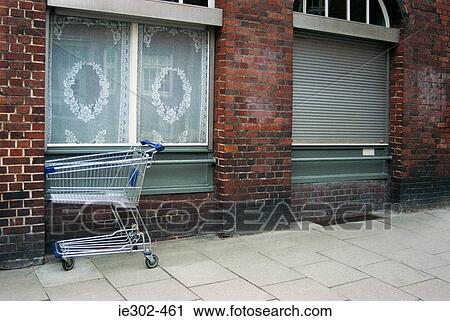 Shopping trolley outside building View Large Photo Image Stock Image - Shopping trolley outside building. Fotosearch