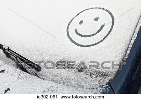 Smiley face in snow on car View Large Photo Image Stock Image - Smiley face in snow on car. Fotosearch