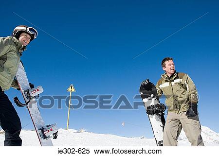 Stock Photography - Snowboarding couple. Fotosearch