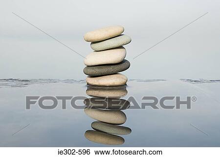 Stack of pebbles and water View Large Photo Image Stock Photograph - Stack of pebbles and water. Fotosearch