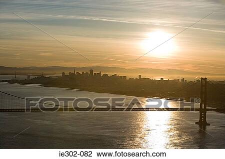 Stock Image - Sunset over golden gate bridge. Fotosearch
