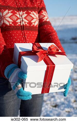 Woman with christmas gift View Large Photo Image Stock Photography - Woman with christmas gift. Fotosearch
