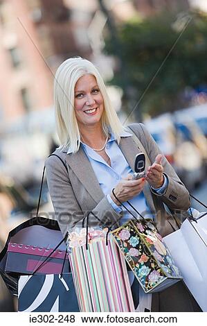 Woman with shopping bags View Large Photo Image Stock Photo - Woman with shopping bags. Fotosearch
