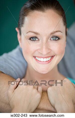 Young woman smiling View Large Photo Image Stock Image - Young woman smiling. Fotosearch