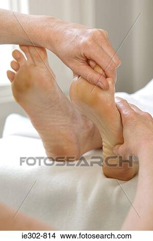 A woman having a foot massage View Large Photo Image Picture - A woman having a foot massage. Fotosearch