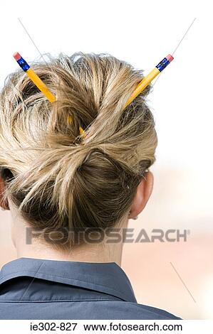 A woman with pencils in her hair View Large Photo Image Stock Photo - A woman with pencils in her hair. Fotosearch