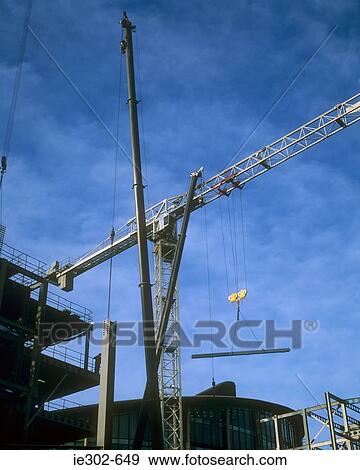Stock Photo - Cranes on a construction site. Fotosearch