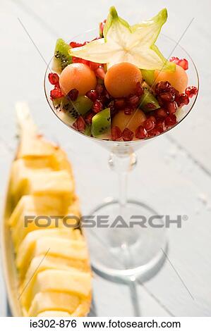Fruit cocktail and a pineapple dish View Large Photo Image Stock Photograph - Fruit cocktail and a pineapple dish. Fotosearch