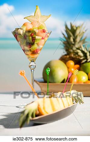 Stock Photography - Fruit cocktail and a pineapple dish. Fotosearch
