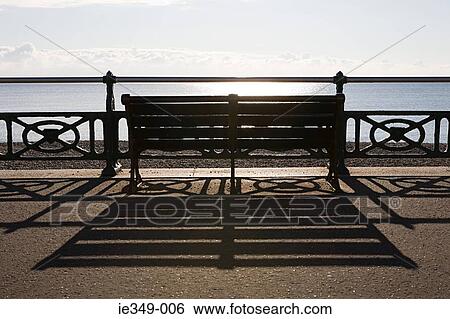 A bench on a promenade View Large Photo Image Stock Photograph - A bench on a promenade. Fotosearch
