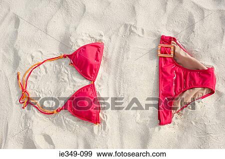 Stock Photo - A bikini on a beach. Fotosearch