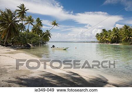 A boat moored in the sea taha'a View Large Photo Image Stock Photo - A boat moored in the sea taha'a. Fotosearch