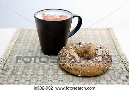Cappuccino and a bagel View Large Photo Image Stock Image - Cappuccino and a bagel. Fotosearch