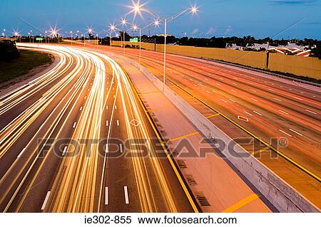 Car lights on a highway View Large Photo Image Stock Photography - Car lights on a highway. Fotosearch