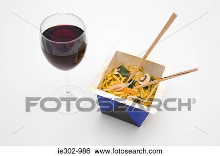 Stock Photograph - Chinese takeaway and a glass of red wine. Fotosearch