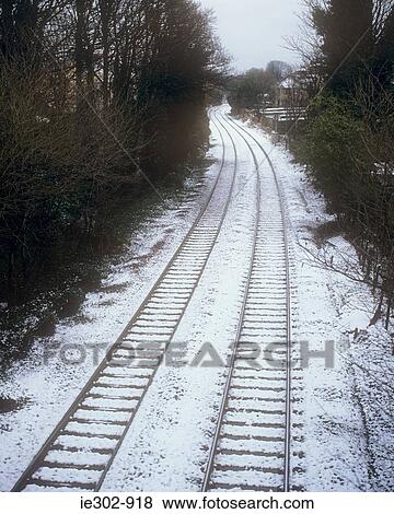Stock Photo - Railway track covered in snow. Fotosearch