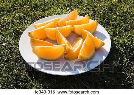 Slices of orange on a plate View Large Photo Image Stock Photography - Slices of orange on a plate. Fotosearch