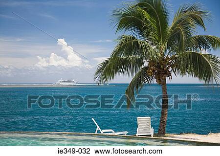 Sun lounger on a beach View Large Photo Image Stock Image - Sun lounger on a beach . Fotosearch