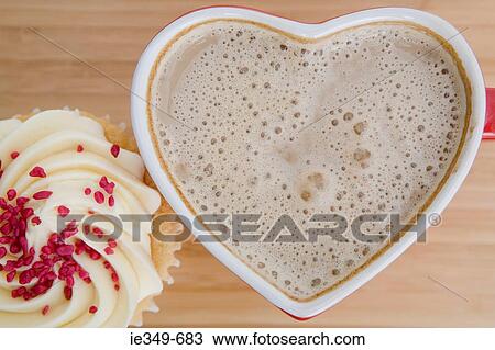 Coffee in a heart shaped cup View Large Photo Image Stock Image - Coffee in a heart shaped cup. Fotosearch