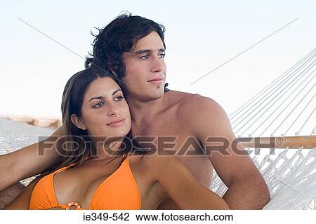 Couple on hammock View Large Photo Image Stock Image - Couple on hammock. Fotosearch
