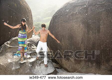 Couple on rocks View Large Photo Image Stock Photo - Couple on rocks. Fotosearch