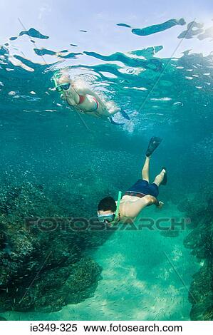 Stock Photography - Couple snorkelling. Fotosearch