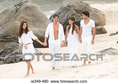 Couples on the beach View Large Photo Image Stock Image - Couples on the beach. Fotosearch