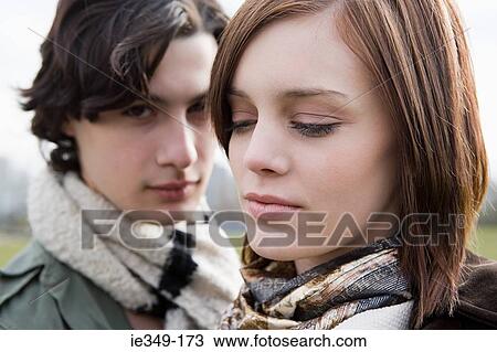 Stock Image - Faces of a young couple. Fotosearch