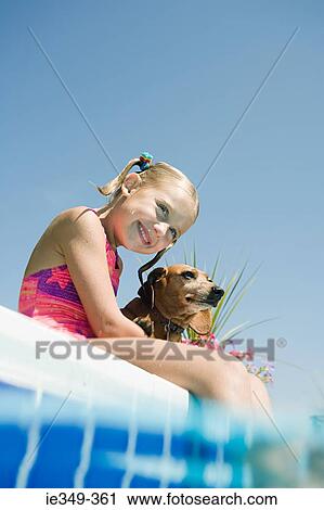 Girl and pet dachshund by pool View Large Photo Image Stock Image - Girl and pet dachshund by pool. Fotosearch