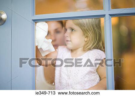 Girl cleaning window View Large Photo Image Stock Image - Girl cleaning window. Fotosearch