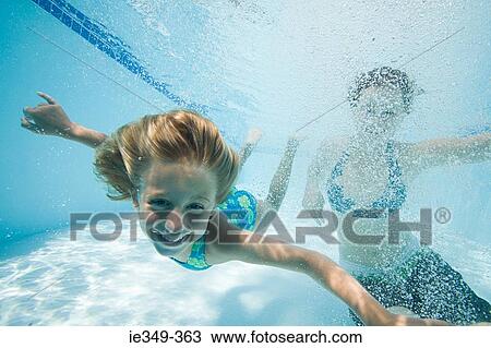 Stock Image - Girls in swimming pool. Fotosearch