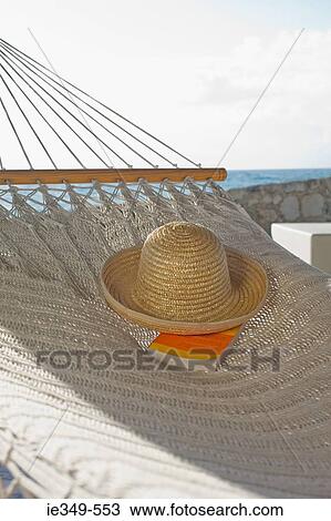Hat and book on hammock View Large Photo Image Stock Image - Hat and book on hammock. Fotosearch