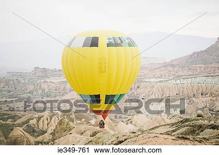 Hot air balloon over cappadocia View Large Photo Image Stock Image - Hot air balloon over cappadocia. Fotosearch