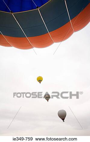 Hot air balloons in sky View Large Photo Image Stock Photo - Hot air balloons in sky. Fotosearch